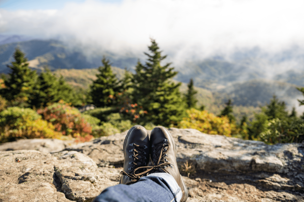 a photo of hiking boots with the laces visible taking a break on the trail